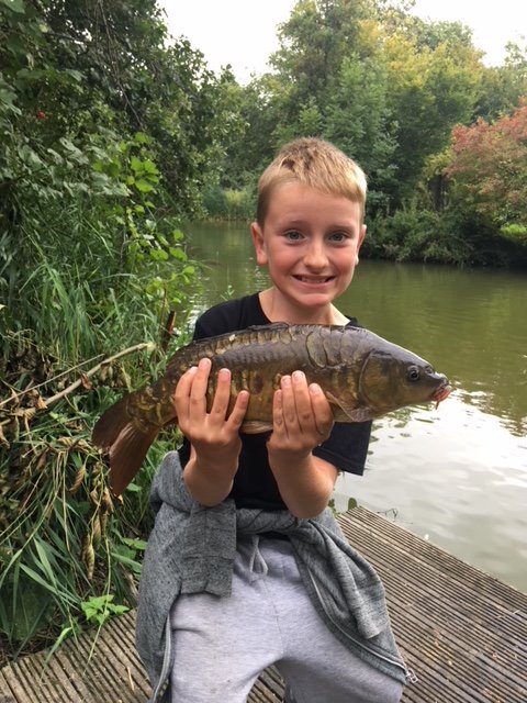 bullockfarm's tweet photo. This is 9 year old Jack with a lovely mirror carp from the Match Lake.  He caught using a float with a size 16 hook and double sweet corn.  Well done Jack, lovely fish!  #mirrorcarp https://t.co/L7EiMaiGTl