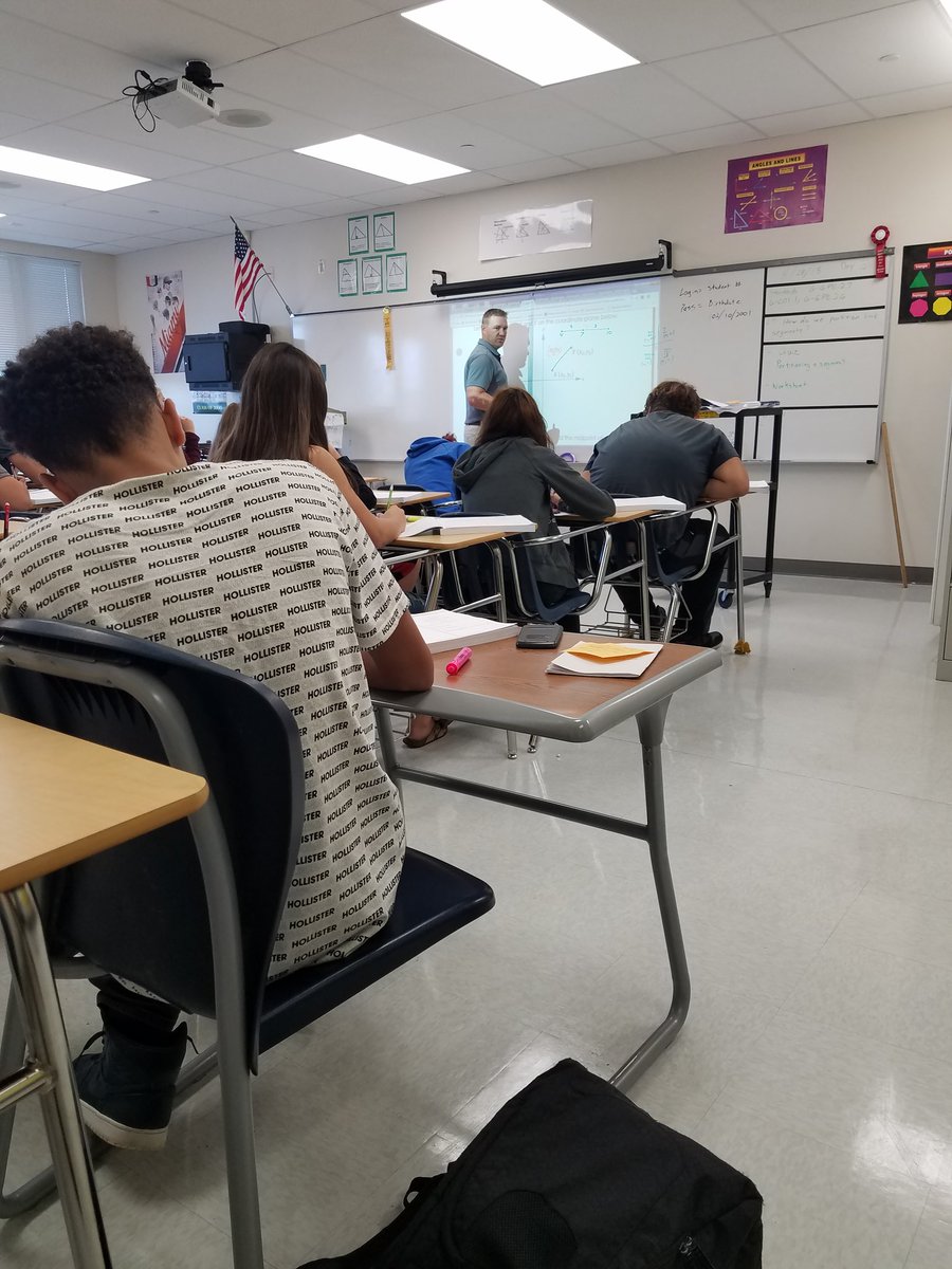 davidassumpcao's tweet image. Coach Logue is showing students on how to find the midpoint using #MathNation workbooks.
#1Lecanto @LHSMath1