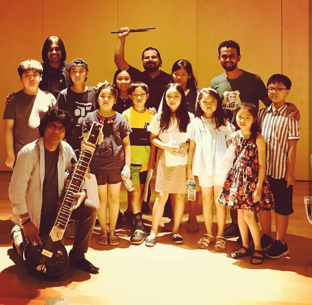 RaviCharySitar's tweet photo. What an amazing time we had conducting a mini workshop for these awesome korean kids introducing them to the basics and nuances of Indian music as a part of the tour en-route collab with the #TuneBand #Korea at the AICC World Music festival at Seoul !! #RaviChary https://t.co/6fhxrWQHph