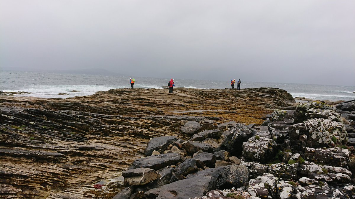 CatrionaDM's tweet photo. Thick merino baselayer, winter fleece, down jacket, waterproof, wooly hat and still shivering. Must be summer on Skye! Fieldwork with @aberdeenuni geology students #summer #rain #skye #mapping #crossbeds #dykes #theresbeautifulscenerybehindtheclouds #soaked #geology https://t.co/9ULQkzJMoA