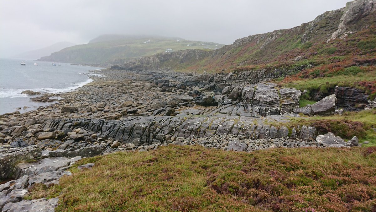 CatrionaDM's tweet photo. Thick merino baselayer, winter fleece, down jacket, waterproof, wooly hat and still shivering. Must be summer on Skye! Fieldwork with @aberdeenuni geology students #summer #rain #skye #mapping #crossbeds #dykes #theresbeautifulscenerybehindtheclouds #soaked #geology https://t.co/9ULQkzJMoA