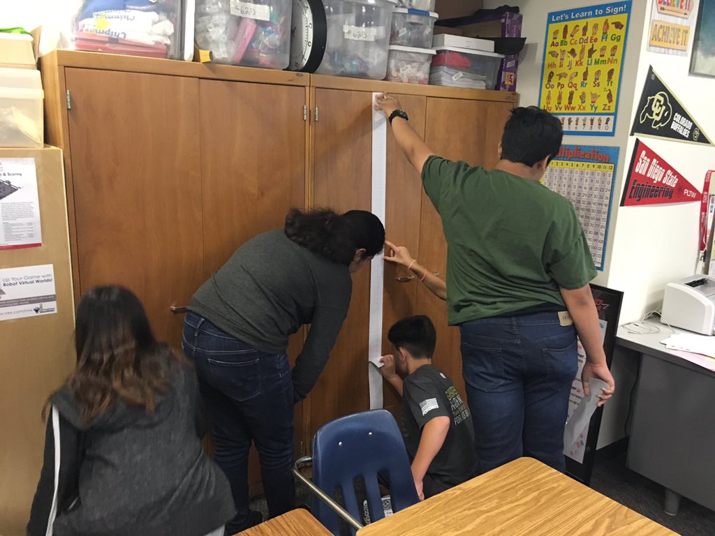 WittmansWorld's tweet photo. Teamwork and collaboration using their handmade rulers to measure. #ChipmanMath https://t.co/TA10DwvKdD