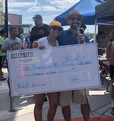 SomervilleRR's tweet photo. Special Thank you to @FederalRealty's @AtAssemblyRow who donated $2000 to the race, all of which will go to our official charities @ESMS, @SomAuxPD and #SomervilleTrackPAC. (Sadly, there's no video of Scott trying to get this giant cheque into the ATM deposit slot) #RaceToTheRow https://t.co/WDLXq0COx3