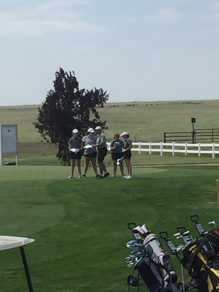 Coach Collins reviewing the rules of play at the Cimarron golf tournament. Go Tribe!