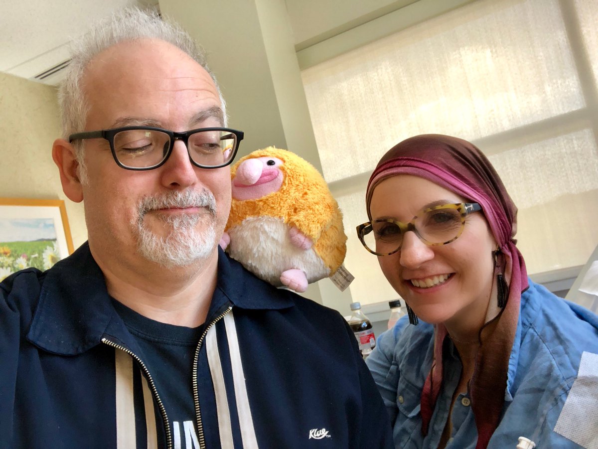 39. Chemo selfie at the halfway mark—5 out of 8 treatments complete. Nancy looks great, like a foxy shaman. Pablo is just happy to be here.