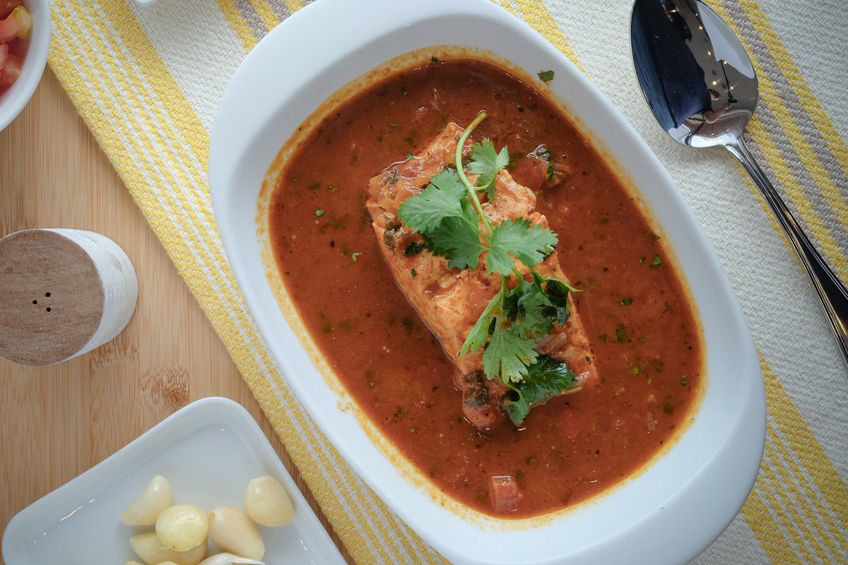Onions, tomatoes and fish broth is what it makes our delicious Sudado de Salmon so special👌🏽🔥