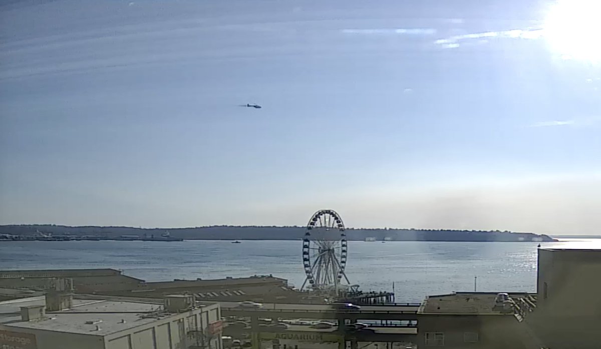 This is the first time I've been able to capture a screen shot of a helicopter flying over Elliott Bay, as seen from the #Seattle #Waterfront #Webcam. 
seattlewaterfrontwebcam.com
