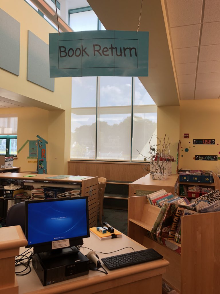 dancelibrarian's tweet photo. Today’s mission is complete - larger hanging signs for easier identification. Created in #gsuite, exported to pdf, printed from Adobe with “poster” option on colored paper. Hanging with magnetized alligator clips a volunteer made. $0 spent on signage. #UsingWhatIHave https://t.co/uTy897G0cm