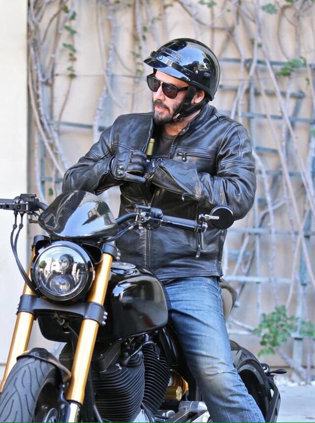keanuthings's tweet image. keanu reeves shoving a bottle of wine into his jacket and riding off on his motorcycle