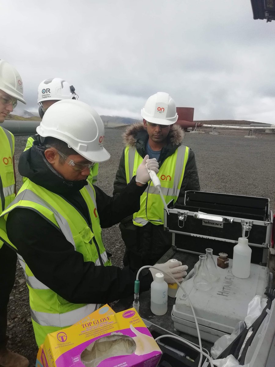 IntCarbonConf's tweet photo. Reykjavík Energy employers, Fríða and Þorsteinn, show a group of Metal-Aid summer school students high temperature geothermal well fluid sampling https://t.co/aqLLiO7W0G