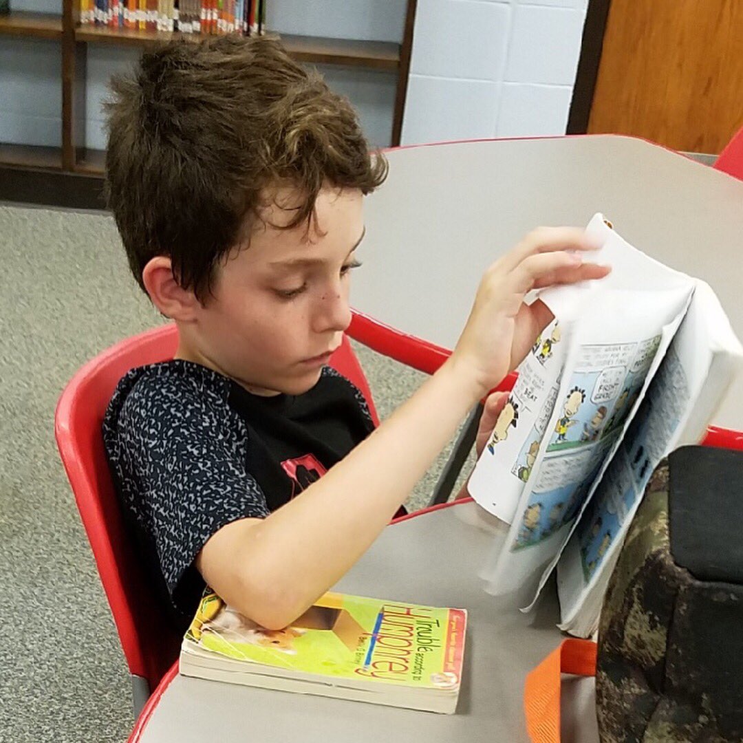 CEWildcats's tweet photo. Check out these 5th graders in Mrs. Wood’s class—engrossed in their books during checkout time in the Library!  We see you!  #centerfieldwildcats #readersareleaders #leadersarereaders #CEfifth https://t.co/fzctxMmHLO