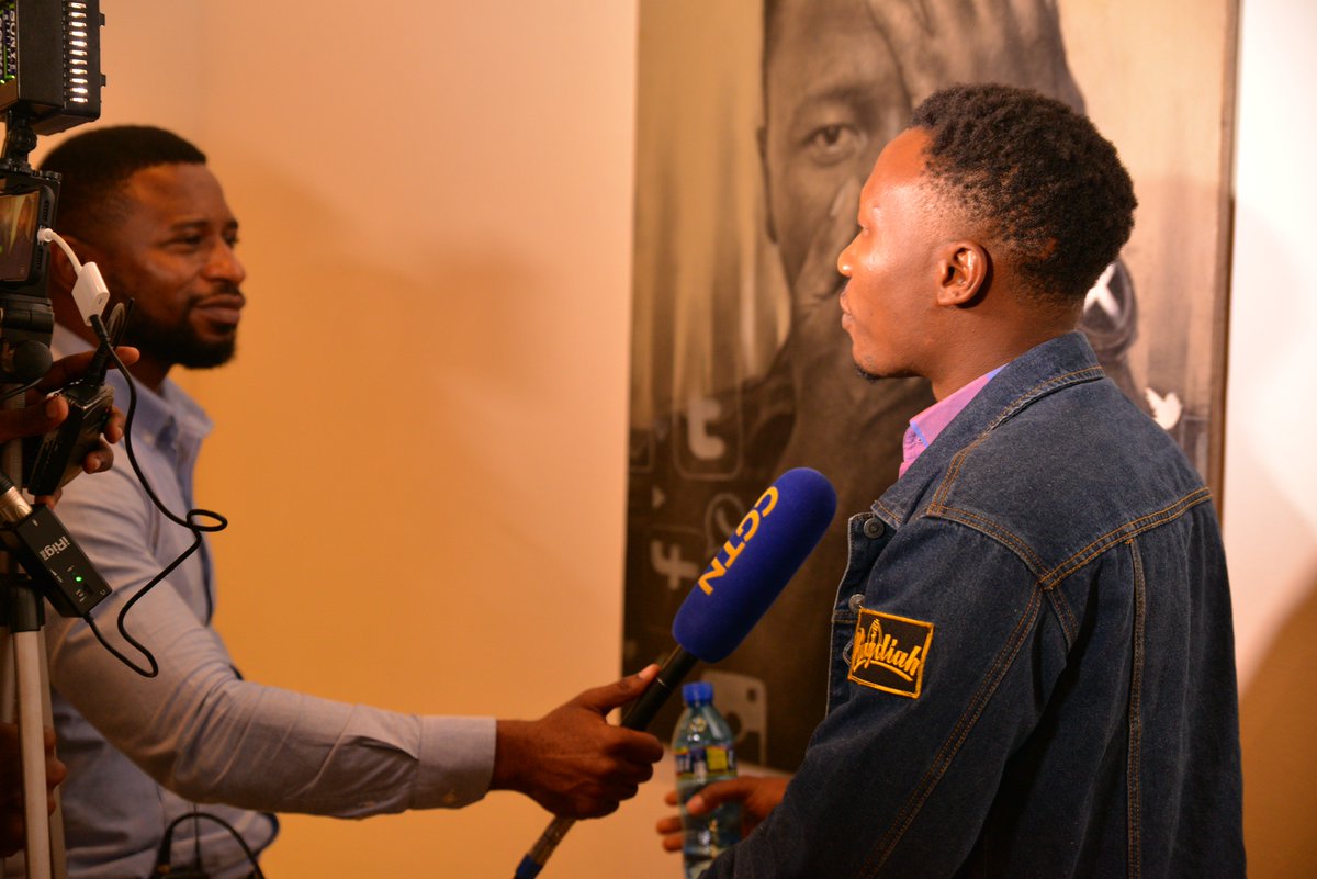 GadiRamadhani's tweet photo. We are happy to have Kolapo O. Olorunyemi, a young professional visual artist, who traveled ✈️ all the way from #Nigeria to attend the #LastImageShow launch today. The #art you see on the background is owned by him #ArtExhibition #ArtGallery https://t.co/de7sGYuLmr