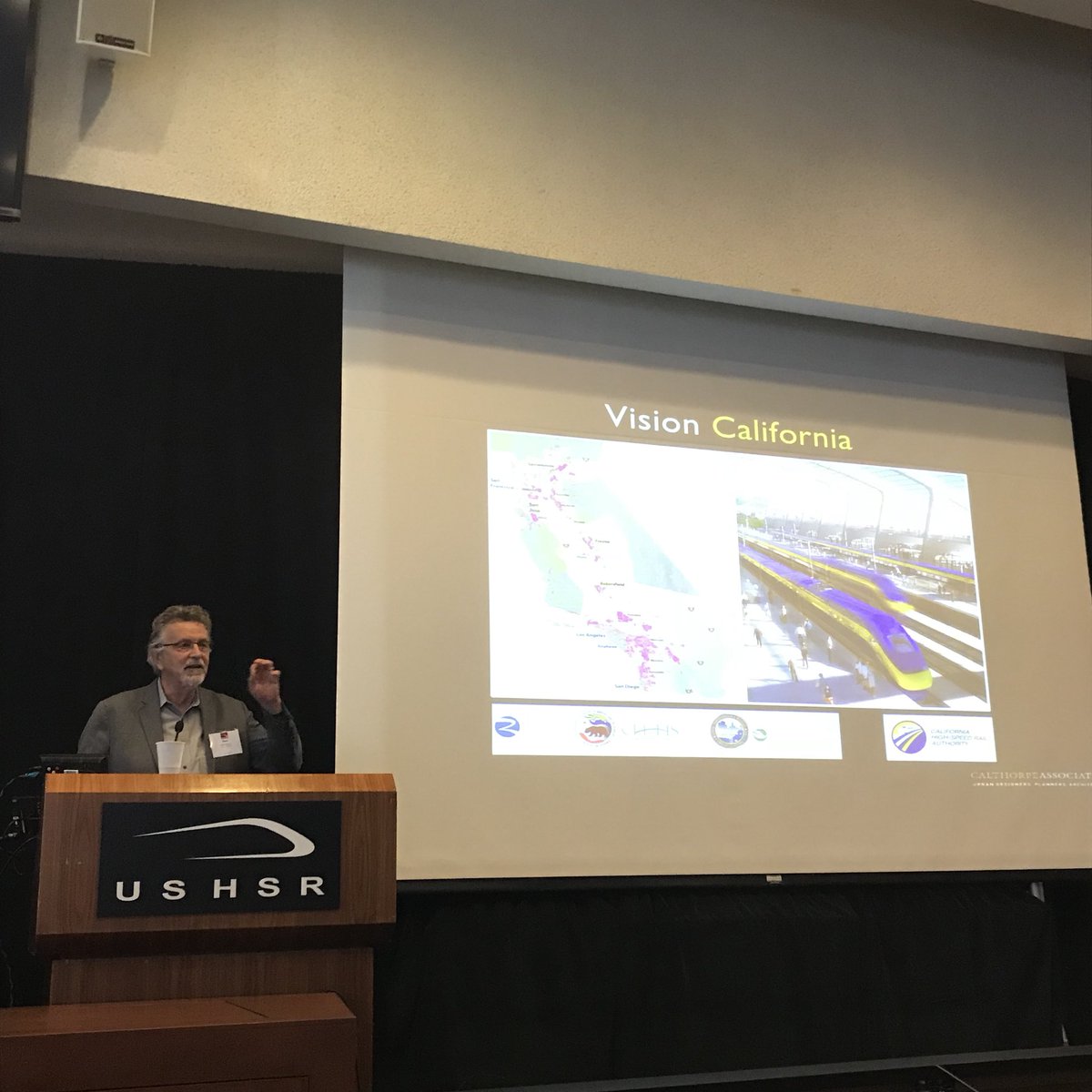 MinetaTrans's tweet image. Peter Calthorpe takes the podium to deliver his presentation on the reach and impact #HSR’s will for anyone seeking a better work life balance and an overall better quality of life #HSRLS @CaHSRA @USHSR @CAgovernment @CityofSanJose