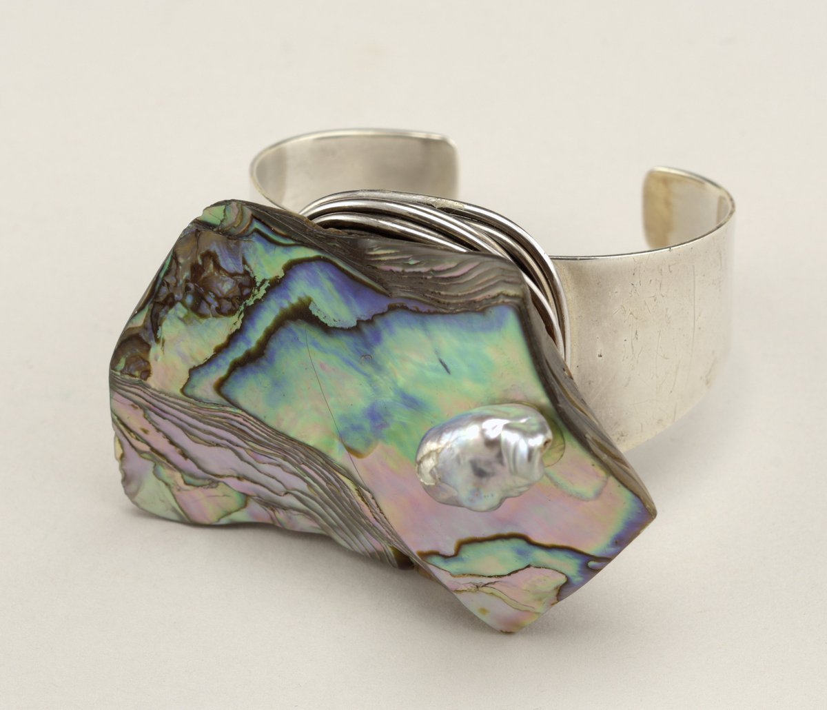 Cuff bracelet with naturally iridescent abalone