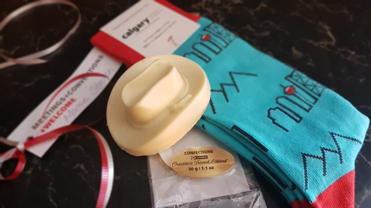 MarnieStretch's tweet photo. Thanks @meetingscalgary @ChocBernCal and @IPBC_Canada! What better way to welcome someone than warm cool socks and white chocolate! 😎 🤠 Mmmm! #ipbc2018 #yyc @Hyatt https://t.co/wnq3AIhQG2