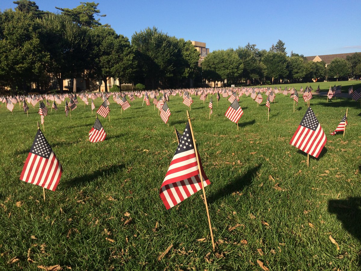 conybearetv's tweet photo. A patriotic but somber display on campus at Notre Dame. The student group Young Americans for Freedom planted 2,977 flags in honor of each life lost in the 9/11 terror attacks 17 years ago. #NeverForgetProject #NeverForget911 https://t.co/GJhL4qbTwA