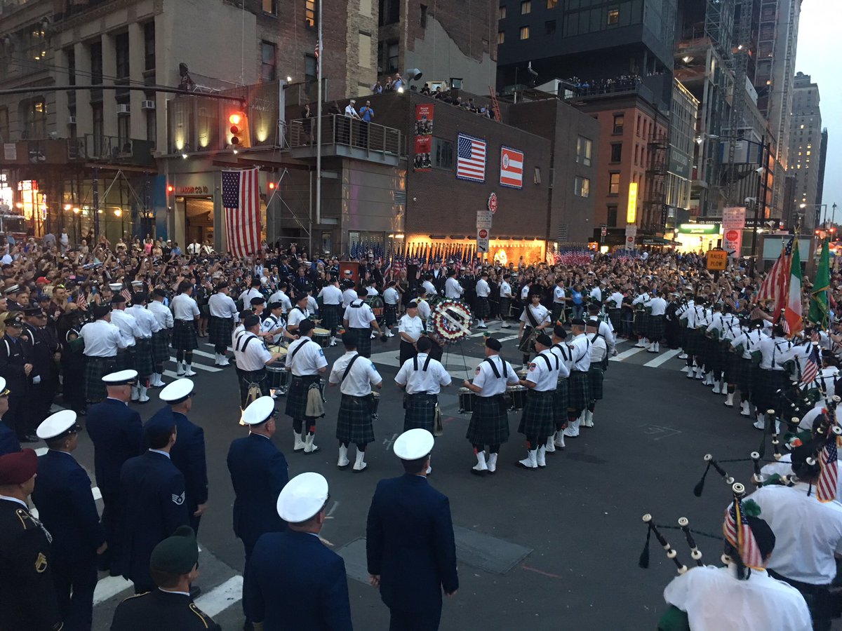 FDNY's tweet image. New Yorkers and visitors to our great city gather for @FDNYpipeband sunset tribute #Engine10 and #Ladder10 #NeverForget
