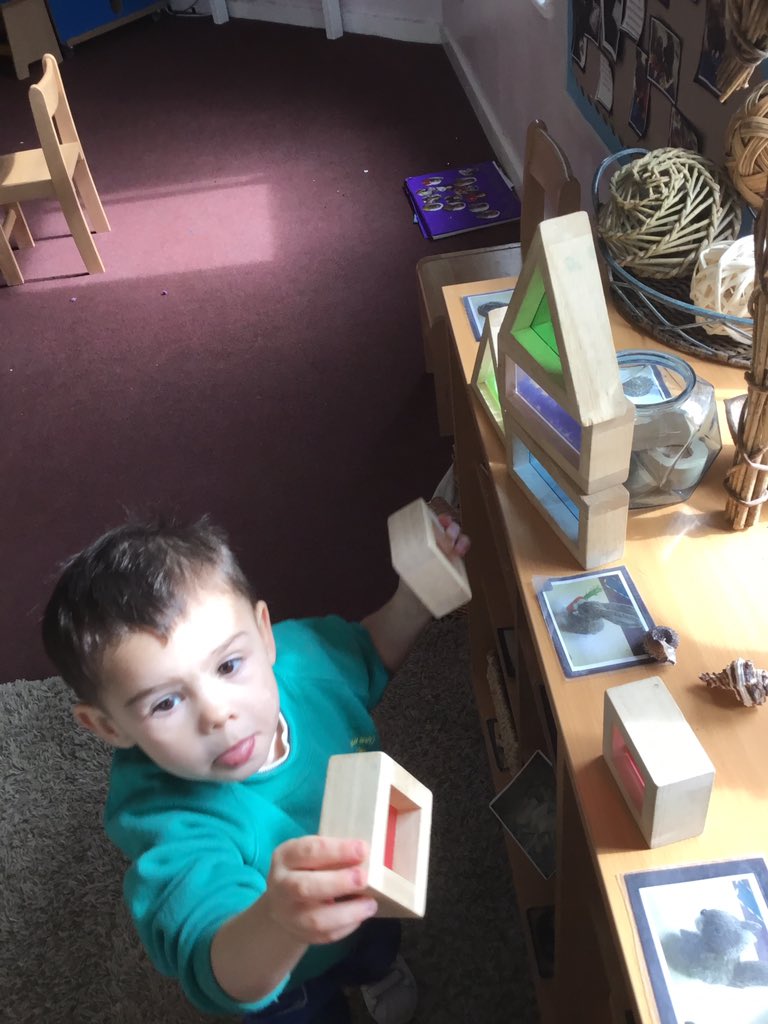 StSerfsPS's tweet photo. J continued with #MathsWeekScot as he explored the different shapes and reflections that the colours were making in front of the window. Staff supported J to recognise the shapes and colours he picked #MathsWeekScot #earlyexploration #loosepartplay https://t.co/OCgjDslaCg