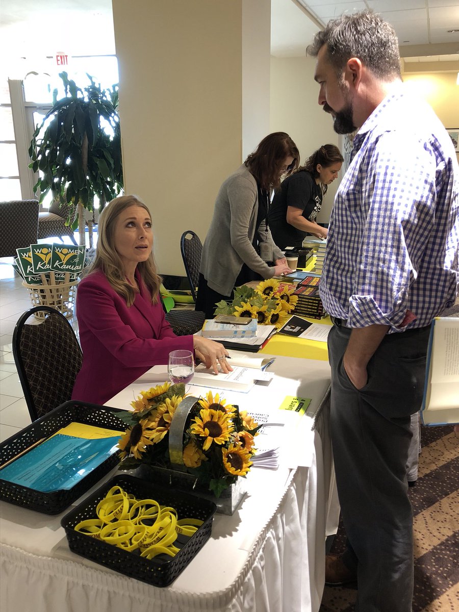 mkayryan's tweet photo. @Sarah_Smarsh signing copies of her new book Heartland at the W4K Showing Our Strength convention in Wichita. https://t.co/wfMGZ4lEDd