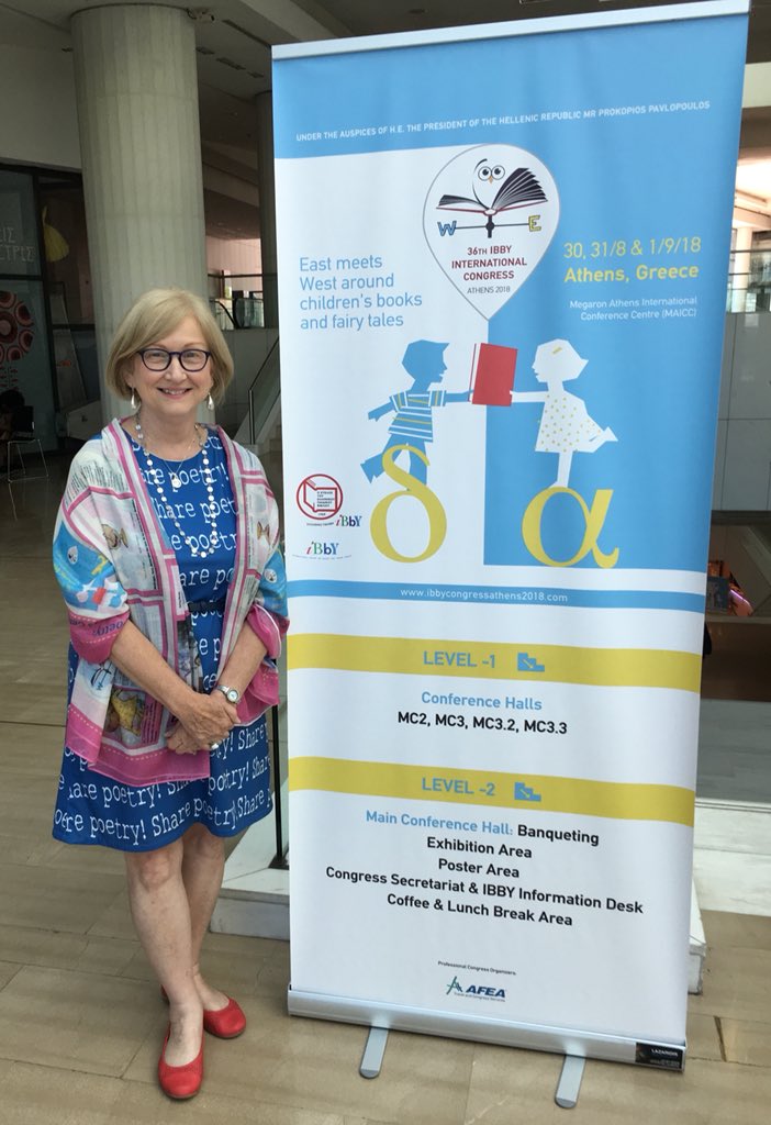 SylviaVardell's tweet photo. Once again, I had fun printing my IBBY presentation poster on a scarf for display and then WEARING my poster/scarf! #IBBY2018 @IBBYINT https://t.co/yKEKIPBIeK