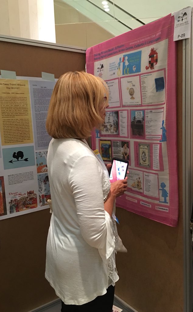 SylviaVardell's tweet photo. Once again, I had fun printing my IBBY presentation poster on a scarf for display and then WEARING my poster/scarf! #IBBY2018 @IBBYINT https://t.co/yKEKIPBIeK