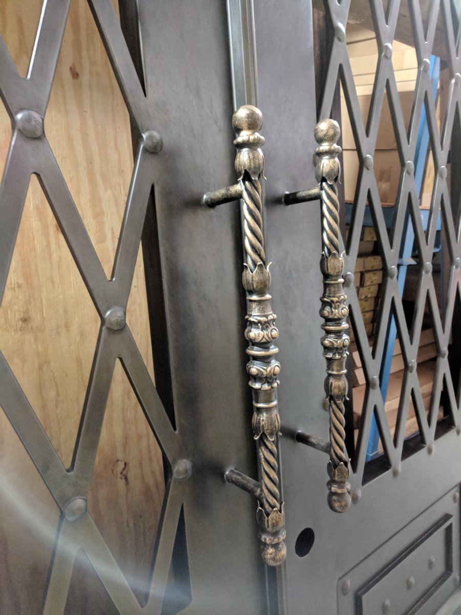 DoorsbyDesign's tweet photo. Here's a sneak peek at a wrought iron door that was recently delivered.  We especially love all the detail work on the handles.  The next step is for the glass to be installed. https://t.co/E6h4a3m95e