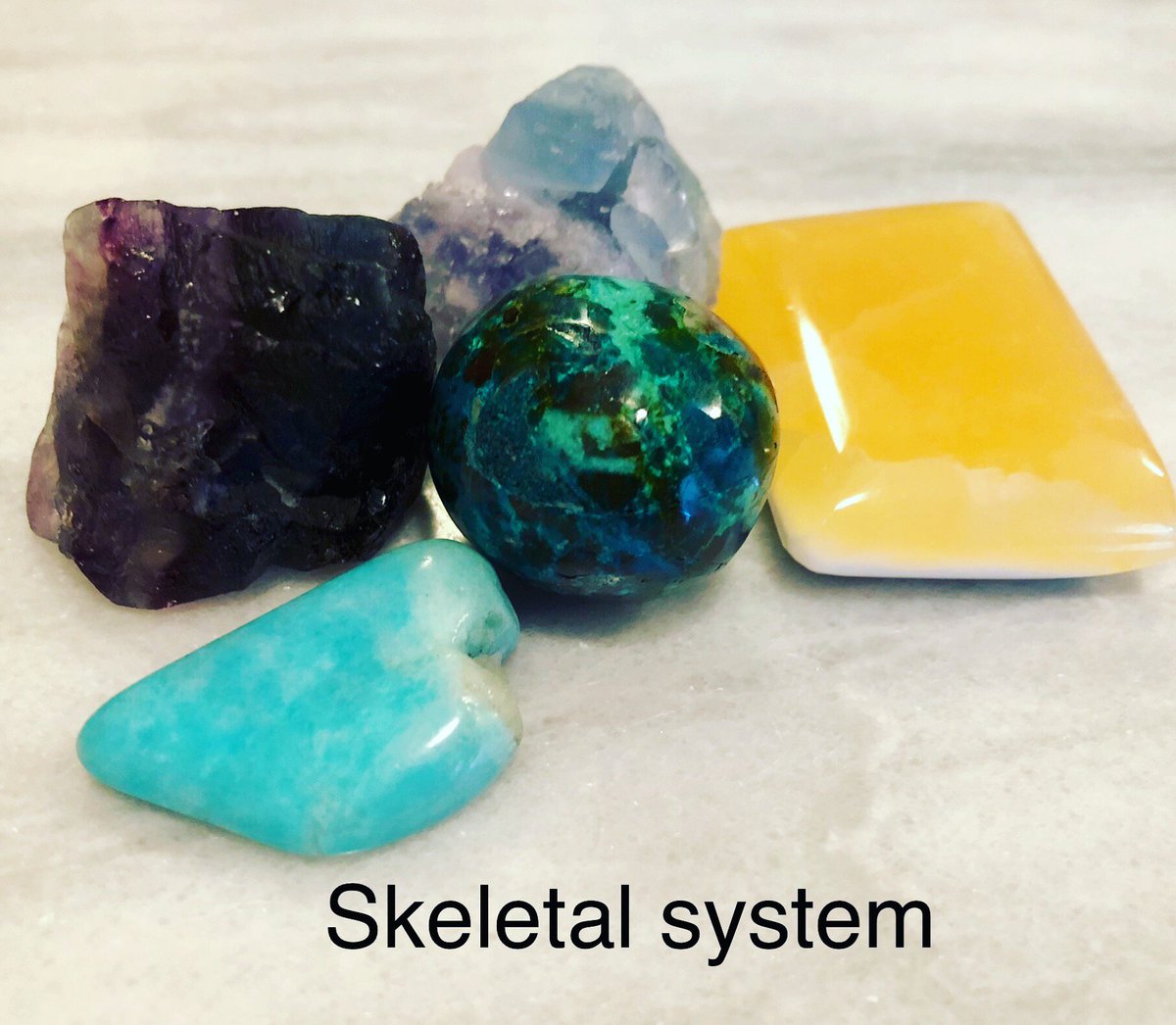 SkyyVisitor's tweet image. #crystals good for the #skeletalsystem according to the #crystalbible #judyhall #orangecalcite #chrysacolla #amazonite #purplefluorite #bluefluorite