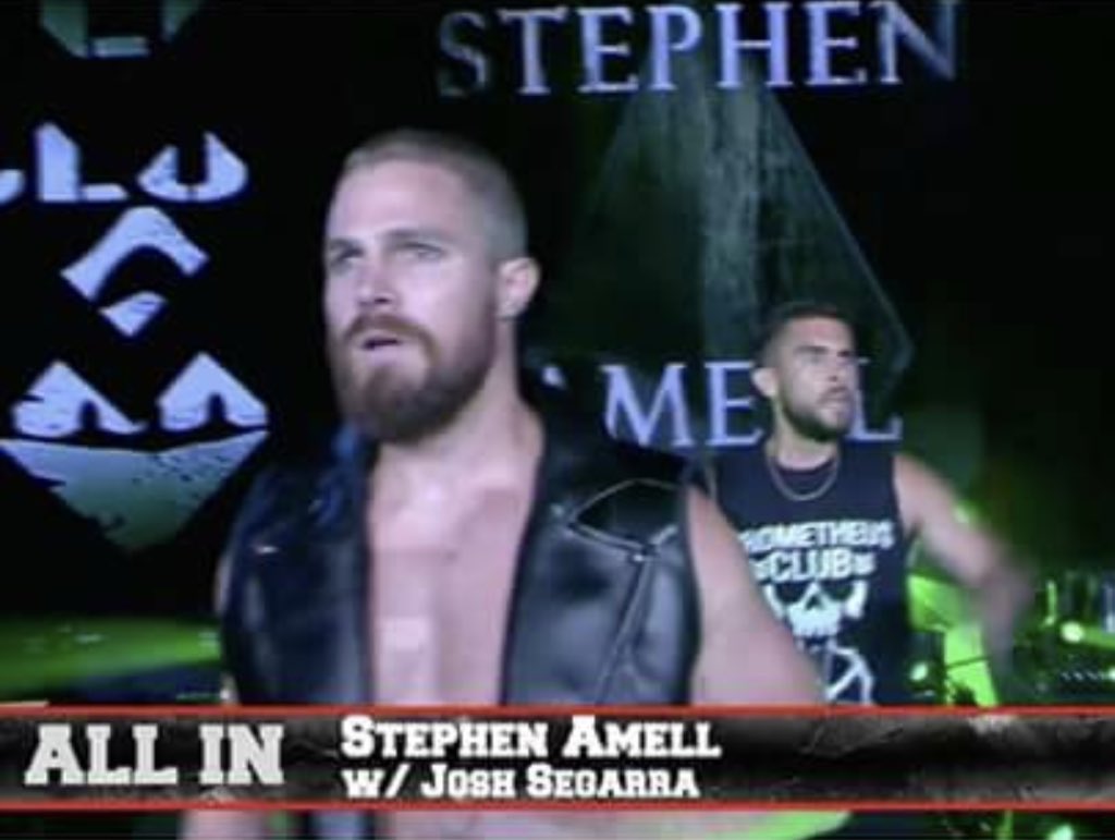 _BellaFam's tweet photo. I AM DYING!!! Not only did Josh show up at #ALLIN, but he’s wearing my shirt!!!!!!! #PrometheusClub @StephenAmell #joshsegarra https://t.co/mlrrQkxb57