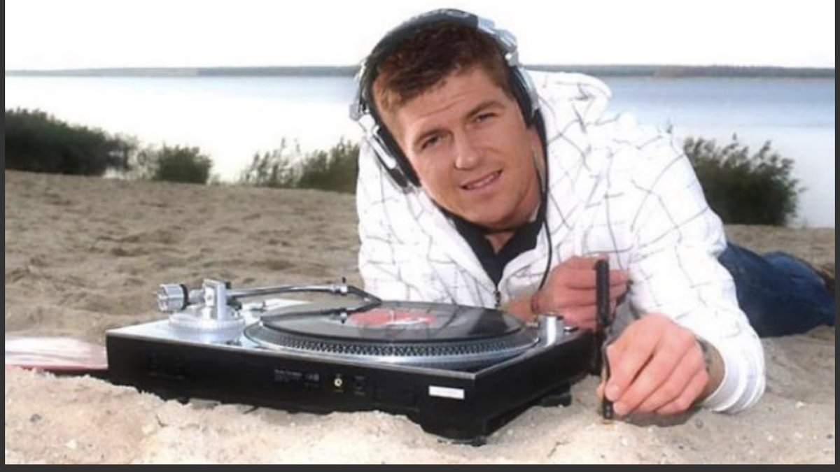 Big__Miz's tweet photo. Steven Gerrard plugs his headphones into the beach. Pass it on https://t.co/S4V6couIgb