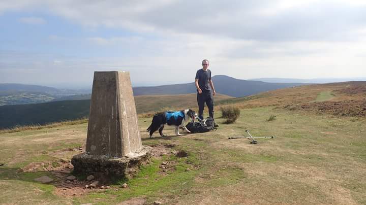 Climbing #CrugMawr along the #BeaconsWay yesterday, with walk leader/dog handler waiting at the summit.