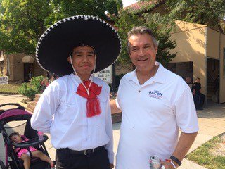 DonJBacon's tweet photo. I met Chuy at Our Lady of Guadalupe's festival in South Omaha last weekend. There were a variety of costumes and dances and everyone had a great time. Thank you to Scott and Father Carl for introducing me to the community! #VoteBacon #NE02 https://t.co/c47N5uSTVD