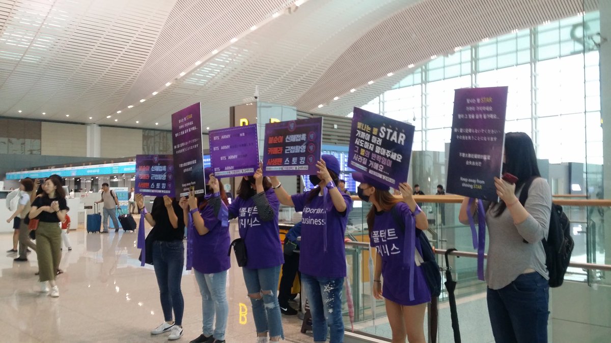 1004JKookie's tweet image. I think these are the purple ribbon project??? They're holding the banner with instructions ask us don't go near to bangtan don't be sasaeng ARMYs need to protect bangtan etc
