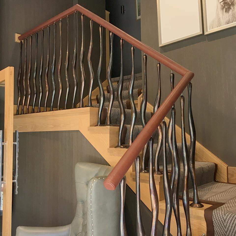 Check out the leather detail in this Lodge project by <a href="/AwlCo/">Artisan Worked Leather Co.</a>, a handrail wrapped in our Hammersmith Bourbon finished with baseball stitching