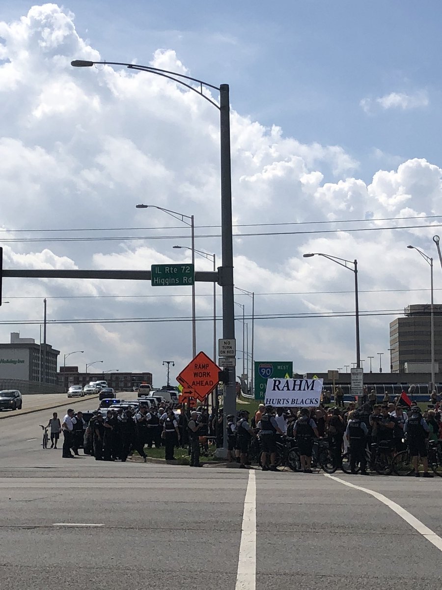 madikellerrrr's tweet photo. Protesters and police officers on the corner of Cumberland Ave #OHareShutDown @CCChronicle https://t.co/2FTq8svV45