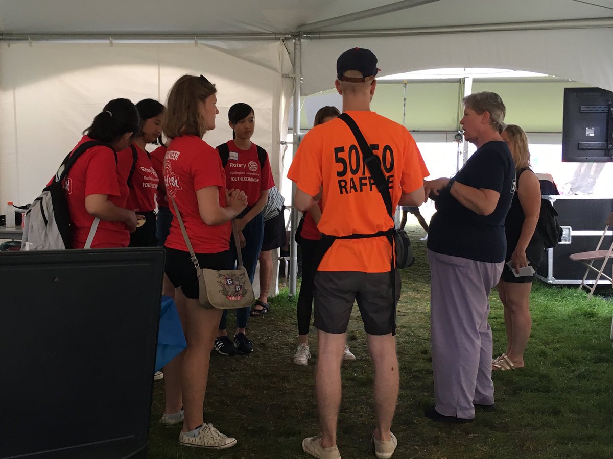 Ryan leading a team of Rotary exchange students as they go sell 5050 tix at Burlington Ribfest