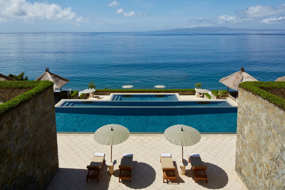 Amanresorts's tweet photo. "Located on a hilltop on Bali's east coast, #Amankila has a three-tier infinity pool spilling down the hillside and looking over the ocean..." @EveningStandard's @_LauraHampson on the most luxurious hotels in #Bali https://t.co/S1VaCTRMSX #AmanAdventures #AmanDesign #Aman30 https://t.co/ng2V4pvAse