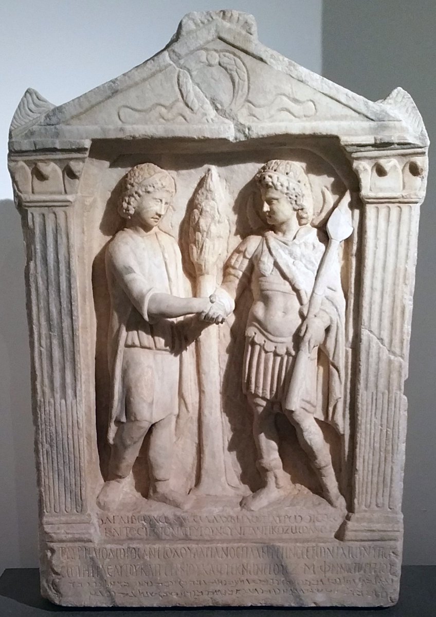 romanarchaeouk's tweet photo. Multicultural Rome: Latin, Greek and Palmyran texts on a dedication in Rome by Caios Aurelios Heliodoros Adrianos, originally of Palmyra, 'to the gods of the fatherland Aglibôl and Malakbêl'. The two Palmyran gods are shown shaking hands #RomanItaly #RomanSyria #RomanArchaeology https://t.co/FTO7Mlinj0