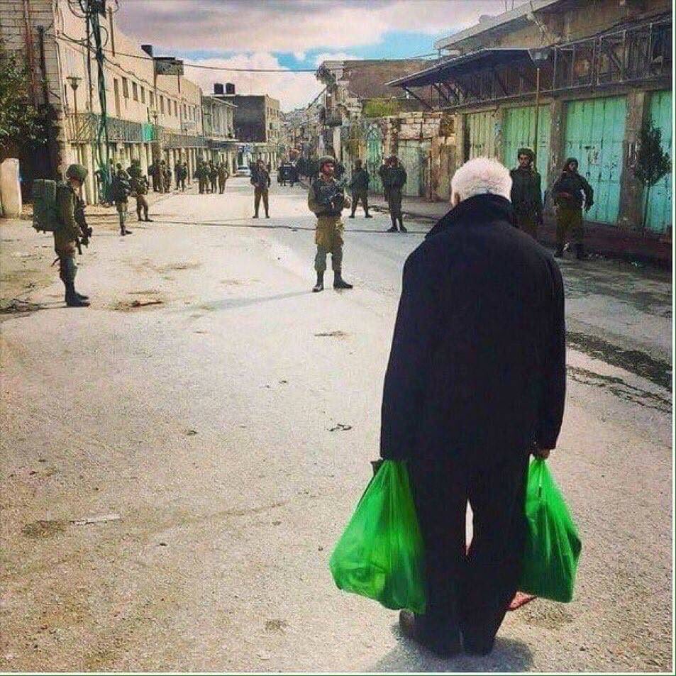 This eerie scene looks like it was made in Hollywood, in fact it's in Hebron, occupied Palestine, where a seemingly simple task like shopping could be a risky undertaking, when you have to run the gauntlet of israeli occupation soldiers