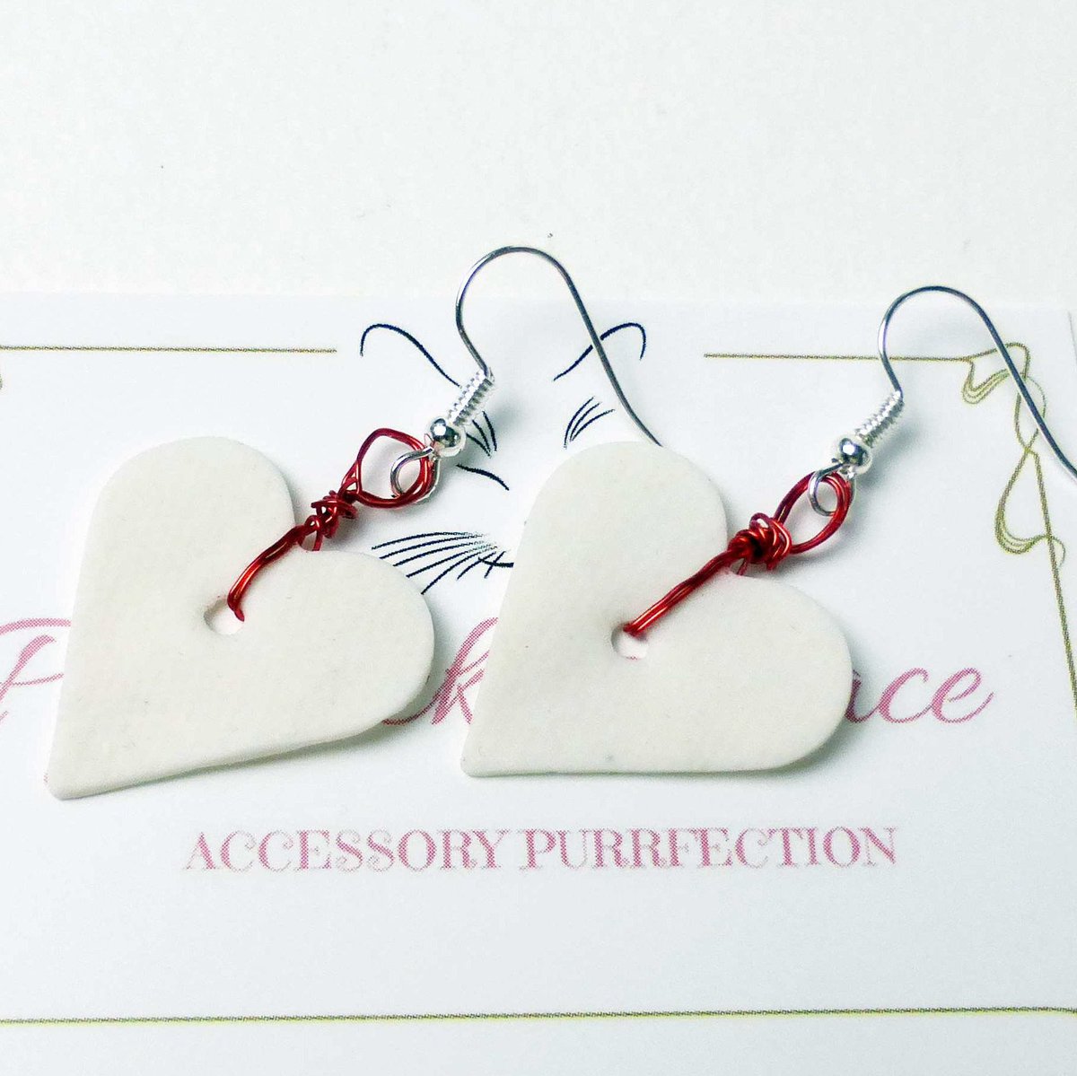 Excited to share the latest addition to #pyewacketsplace #WhiteHeartEarrings  #LoveHeartEarrings #WhiteEarrings #HeartDroppers #GiftForHer #CeramicHearts #ValentineGift etsy.me/2LXndij #jewellery #earrings #white #red #heart #ceramic #earwire