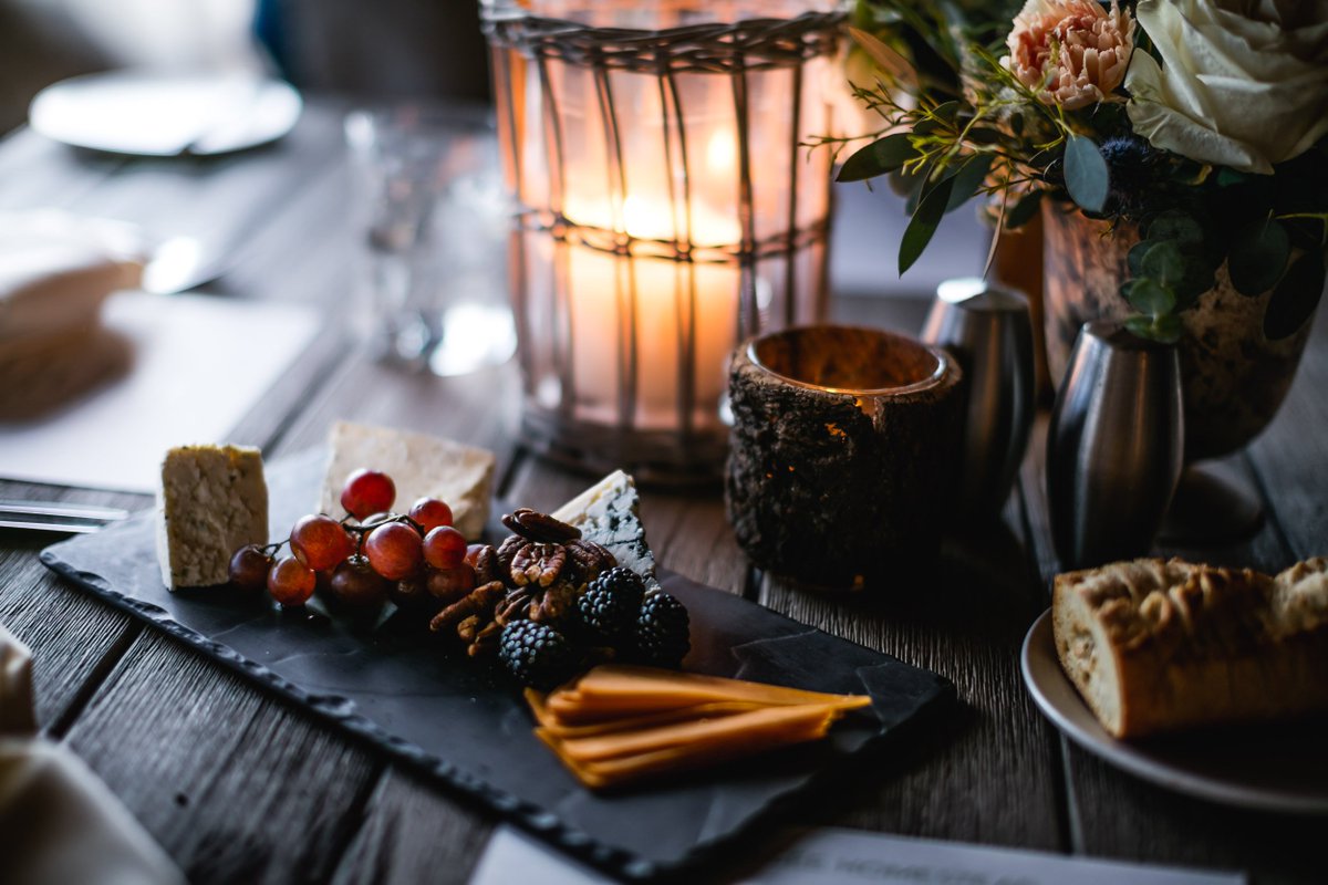 Warm candlelight, a perfectly set tablescape, soft sounds from a live guitarist, house made breads and a variety of international cheese. Welcome to cocktail and hors d'oeuvres hour at the Magee Homestead. Photo: @robertcolephotography