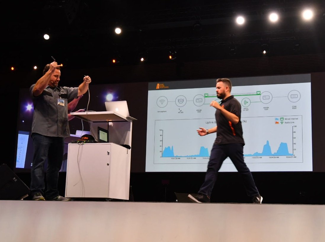 alanjni's tweet image. .@thedanrivera cutting the Ethernet cord to the conference network, .11ad saves the day for @MadaniAdjali #ATM18APAC #invisiblenetwork