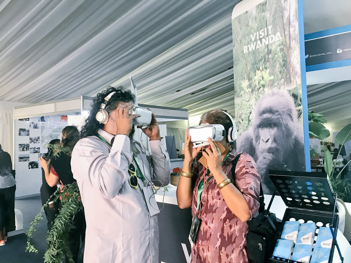 Two journalists from India visit our booth to experience Rwandan culture & a City of Kigali tour through #VirtualReality after a fun day gorilla trekking at Volcanoes National Park yesterday. #ConservationisLife #KwitaIzina2018