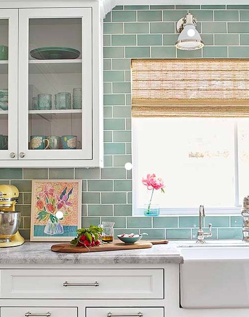Adding a backsplash to your bathroom or kitchen will give the space a whole new look; it’s a budget-friendly update that’s easy to install!