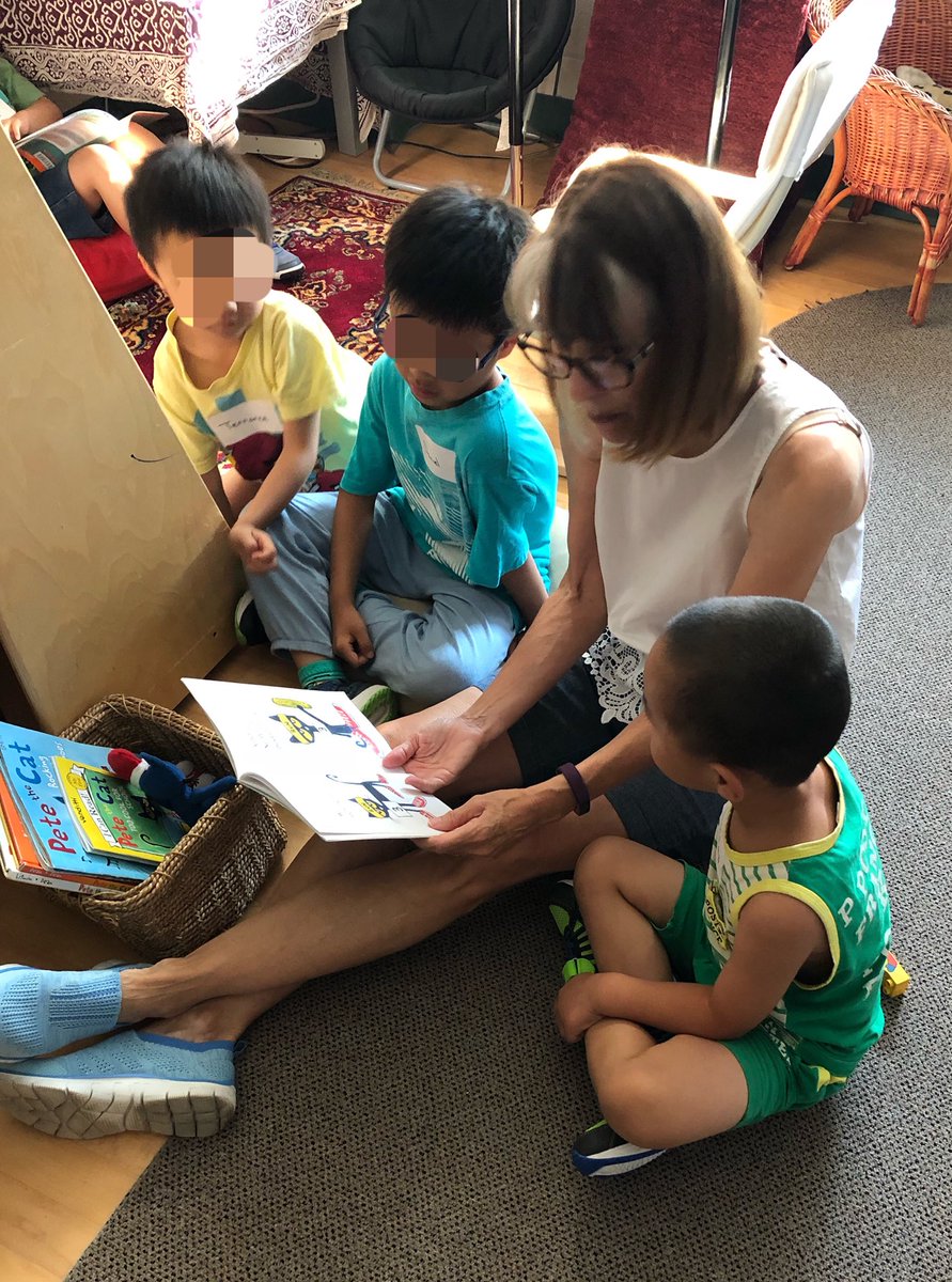 newsfromK124's tweet photo. A group of children enjoy some stories with our wonderful volunteer Mrs. V. #readitagain #readthisone https://t.co/eJU1kXX6fJ