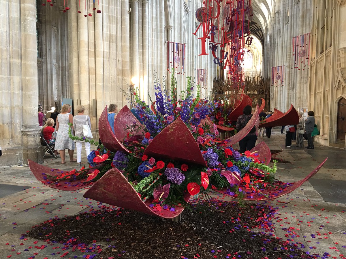 Winchester Cathedral is hosting a #FestivalofFlowers inspired by the #illuminations of the Winchester Bible. You walk in and immediately see these enormous displays.