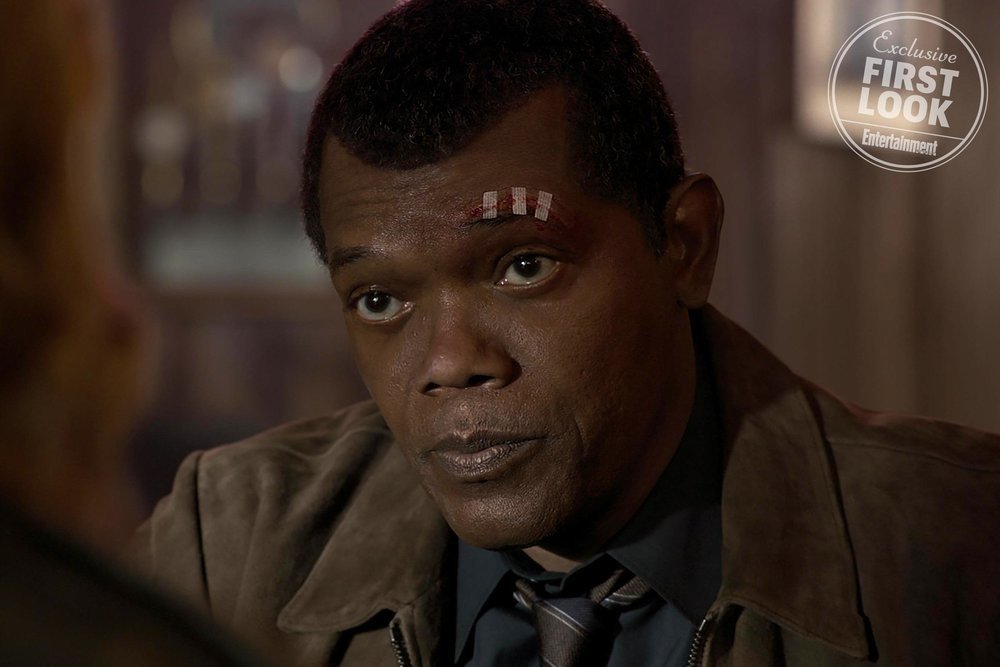 Captain Marvel marks Samuel L.  Jackson’s ninth appearance as Nick Fury, but this Nick is a lowly  S.H.I.E.L.D. desk jockey (who hasn’t yet met any superheroes). He’s  younger than we’ve ever seen him (Jackson was digitally de-aged for the  role), -- Entertainment Weekly