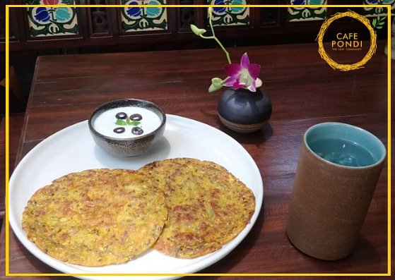 CafePondi's tweet photo. This Nutrition week, visit Cafe Pondi to try our multigrain flour sprouted Green Moong Chilla served with curd, cucumber and black olives raita! If you participate in the #HumFitTohIndiaFit challenge by sharing your fitness mantra and tagging us, you get this dish on the house! https://t.co/UQ9EXkv85g