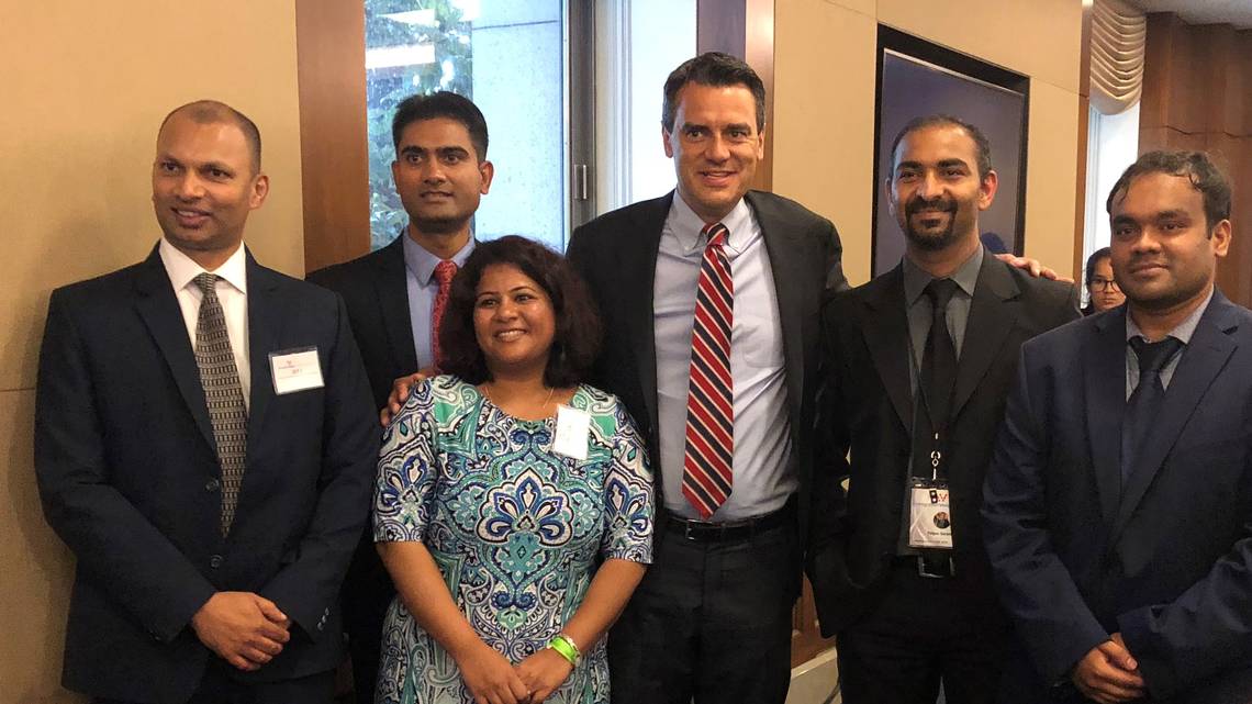 Kevin Yoder poses with Indian-born activists seeking green cards