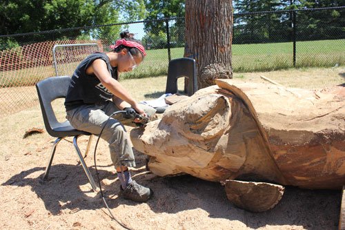 markham_square's tweet photo. Art students at Unionville High School are carving fallen trees into eight thrones based on Indigenous teachings. Once completed, the thrones will be placed in each of Markham’s eight wards. https://t.co/a4gnIXKgEy https://t.co/4gsalvG82C