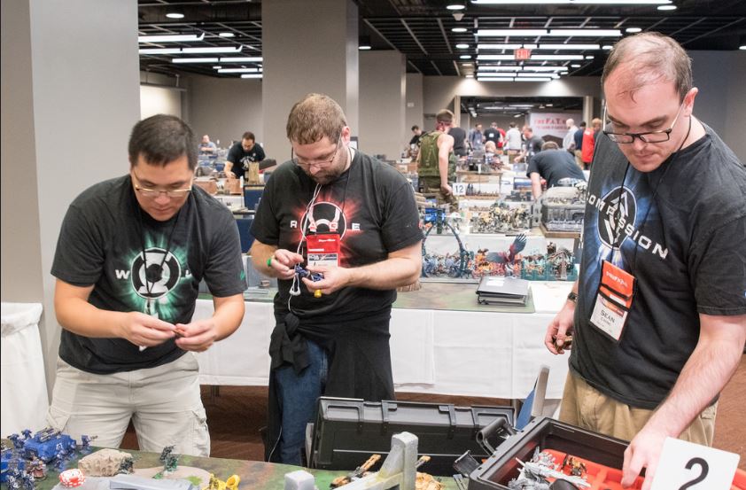 wildvulture's tweet photo. Our #NovaOpen2018 team was based around the Lantern Corps! I was Hope and Compassion, Jay was Willpower and Greed, Kevin was Rage and Fear. We had rings, shirts and painted our armies accordingly. They had a green screen and props, and I can never, ever resist a goofy photo op. https://t.co/YdrriI1s2I